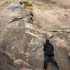 Me on the first pitch about to hit the perfect hand crack in the middle of the route. The route veers to the left towards the flakes. X marks the anchors you can choose, but be weary of the difficult traverse to the left.